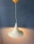 Small white mid century space age witch hat pendant lamp. The shade is made out of metal and has a white/beige lacquer....
