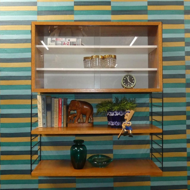 An absolute classic! Simple, Swedish design Design classic Nisse Strinning designed his famous shelving system in 1949. It...