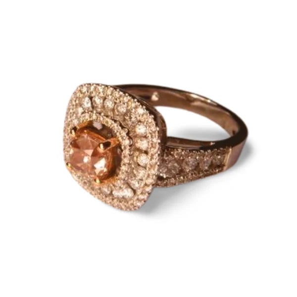 This engagement ring band is crafted in 18K white gold and features one natural cushion-cut fancy brownish pink diamond...