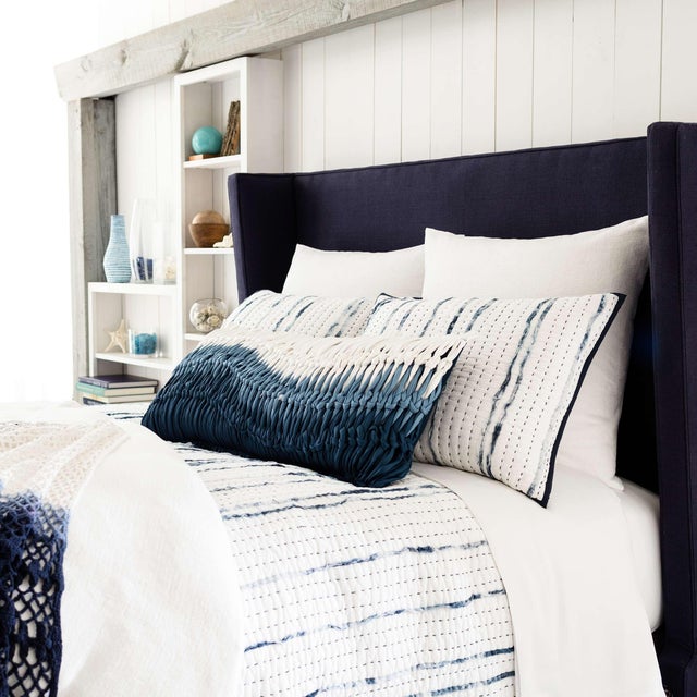 Inspired by traditional Indian kantha quilts, this silky-soft cotton voile quilt features textured, speckled indigo...