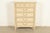 A gorgeous French Regency Louis XVI style highboy dresser In the manner of John Widdicomb By Dixie USA, Circa 1960s Carved...