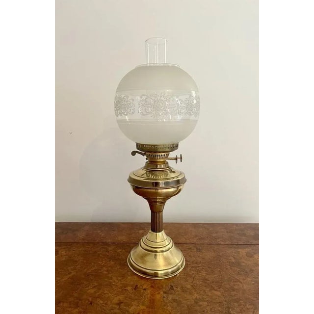 Antique Edwardian quality brass and glass oil lamp having the original white coloured patterned glass shade above a brass...