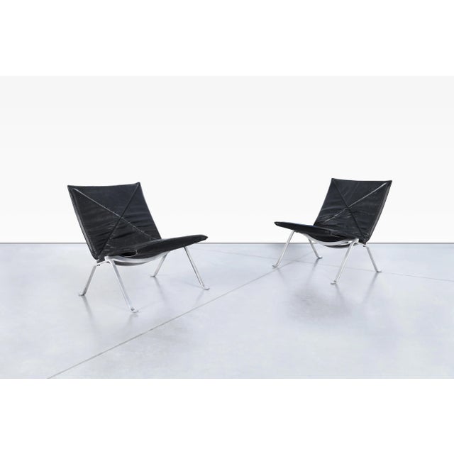 An enduring icon of Danish Modern design, this early example of PK22 lounge chairs was designed by Poul Kjaerholm and...
