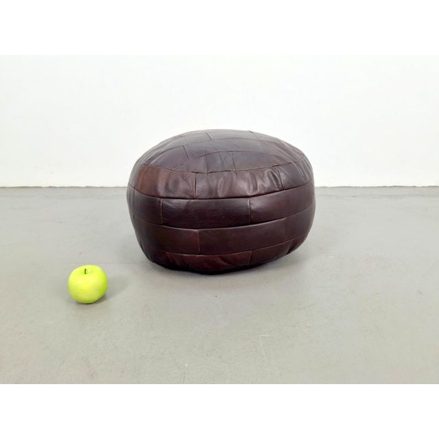 Vintage french patchwork leather ottoman, bean bag or pouf, 1960s measurements: height 32 cm, width 51 cm, depth 51 cm...