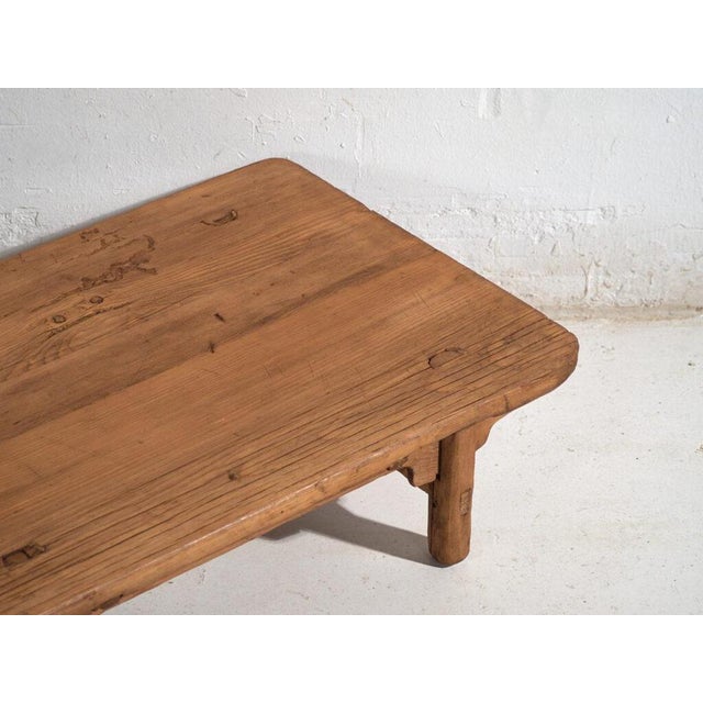 Antique low table in pine wood, traditional chinese furniture originating from northern china and dated circa 1930....