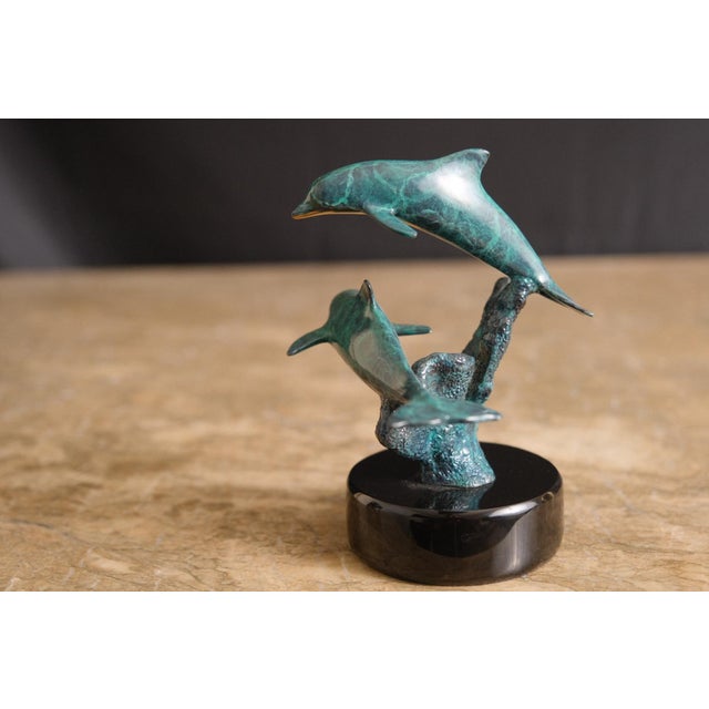 Celebrate the beauty of marine life with this stunning limited edition bronze sculpture by renowned artist Christian Riese...