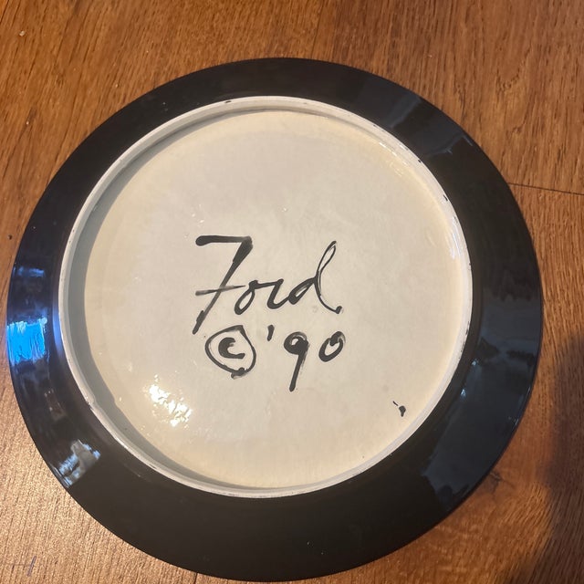 Denise Ford Arabian Themed Beige Pottery Plate from 1990. This plate has a really fun design of camels and palm trees. The...