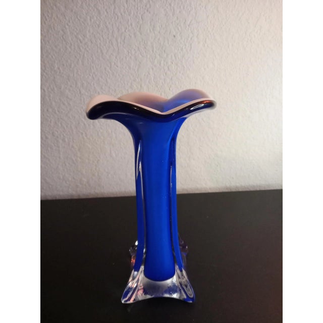 This is a Blue Art Glass 7" Ruffled Edge Swung Vase. Procured at an auction