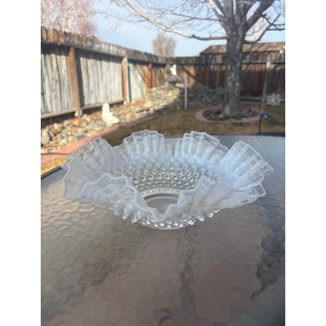 An elegant art glass hobnail centerpiece bowl by Fenton. There is a wonderful blue opalescence in this bowl. It is so...