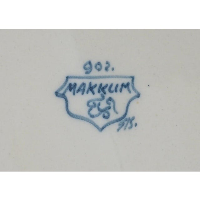 Bring mid-century Dutch charm to your walls with this vibrant Makkum Tichelaar ceramic plate, hand-painted with a colorful...