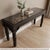 Dimensions: 62" Wide X 18" Deep X 32" High Vintage hand carved window with a metal grill has been thoughtfully repurposed...