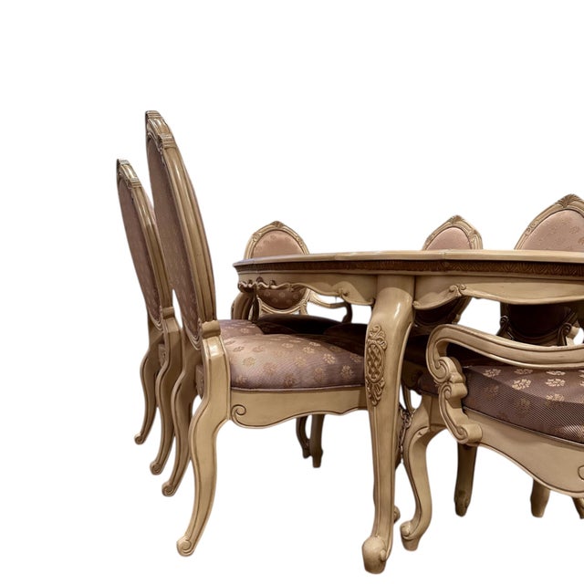 Crafted by AICO (Amini Innovation Corp), founded by Michael Amini, this dining set reflects the brand’s signature blend of...