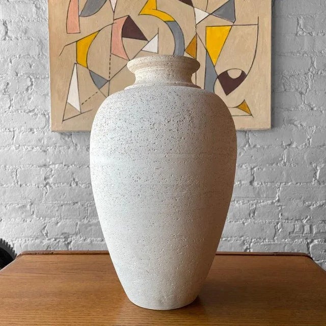 Large, Italian, mid-century, earthenware vase by Flavia Montepulo features a classical urn shaped form in a poruous, matte...