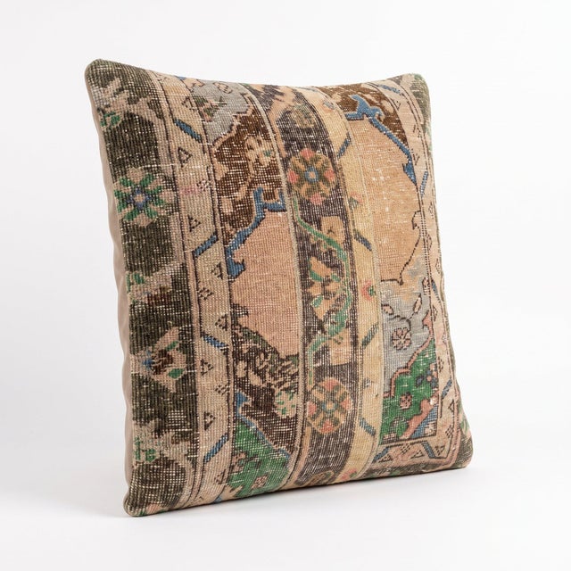 This 24'' x 24'' pillow cover was made from an authentic Turkish rug — Bohemian Oushak panels in blush, green and brown....