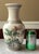 This elegant vintage Chinese porcelain vase stands 11 inches tall and features a beautifully detailed, hand-painted...