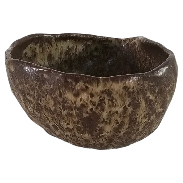 A hand-thrown studio pottery bowl signed Rubio, dating to the late 20th century (circa 1970–1990). Formed in dense brown...