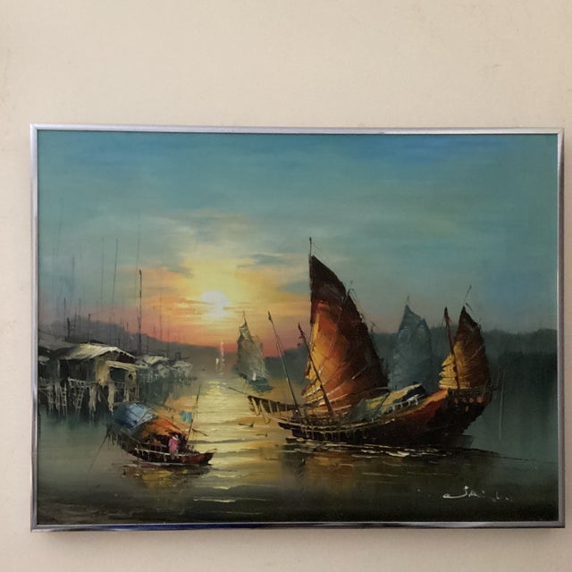 This product is a large original painting on canvas featuring Chinese junks sailing boats on a sunset harbor. The painting...
