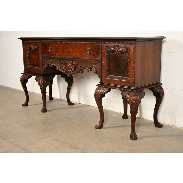 An exceptional Chippendale or French Rococo style sideboard, credenza, or bar cabinet In the manner of Berkey & Gay...