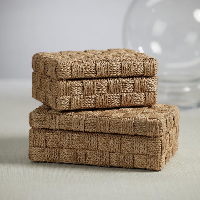 Abaca rope has been neatly woven to craft this unique decorative box that is as cool as an ocean breeze. The lattice work...