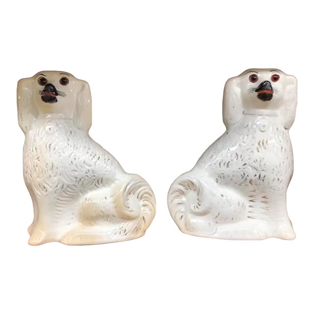 Pair of Early 20th Century White Staffordshire Porcelain Spaniel Dog Figurines With Glass Eyes For Sale