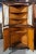 Mid Century wooden triangular corner cupboard with four doors and interior shelves. Curtain rods can easily be removed...