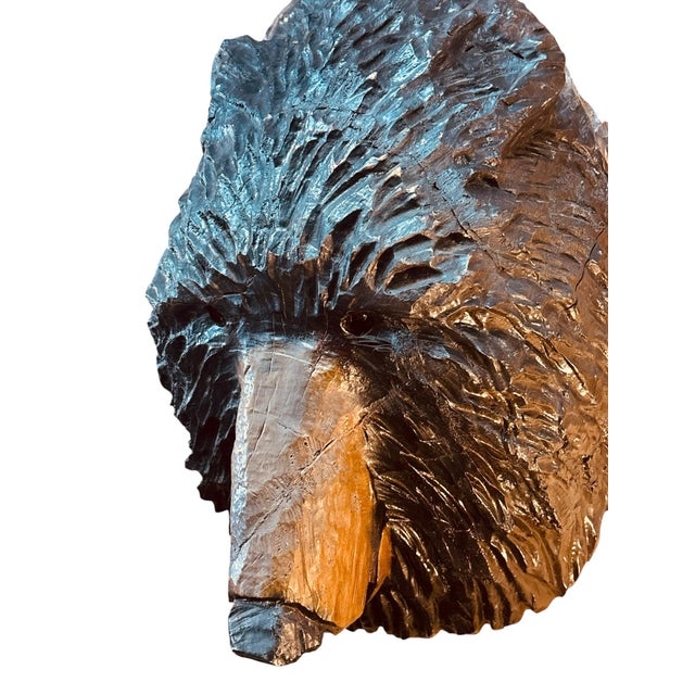 Striking hand-carved folk art sculpture depicting a black bear emerging from a natural tree trunk. Expertly carved in high...