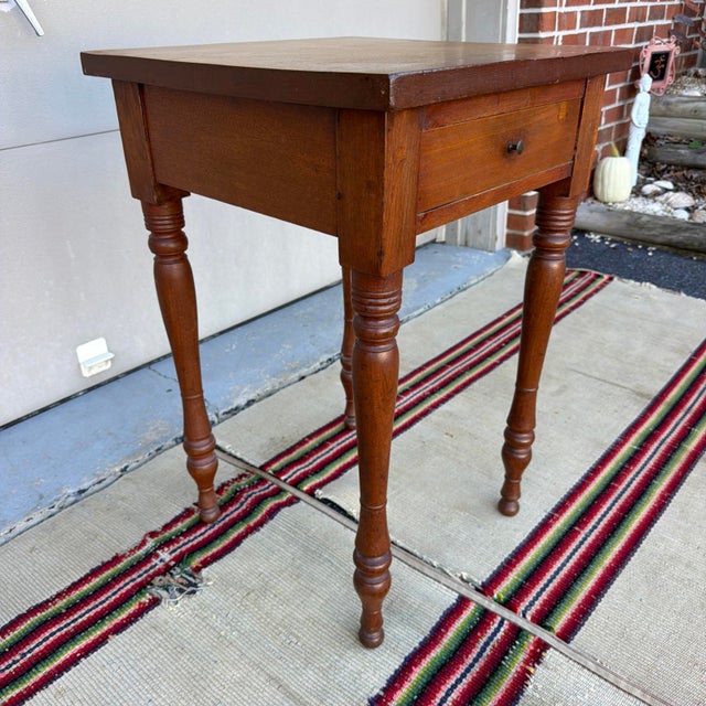 Antique Sheraton Walnut One-Drawer Side Table, Pennsylvania, circa 1830s A slim antique Pennsylvania one-drawer stand in...