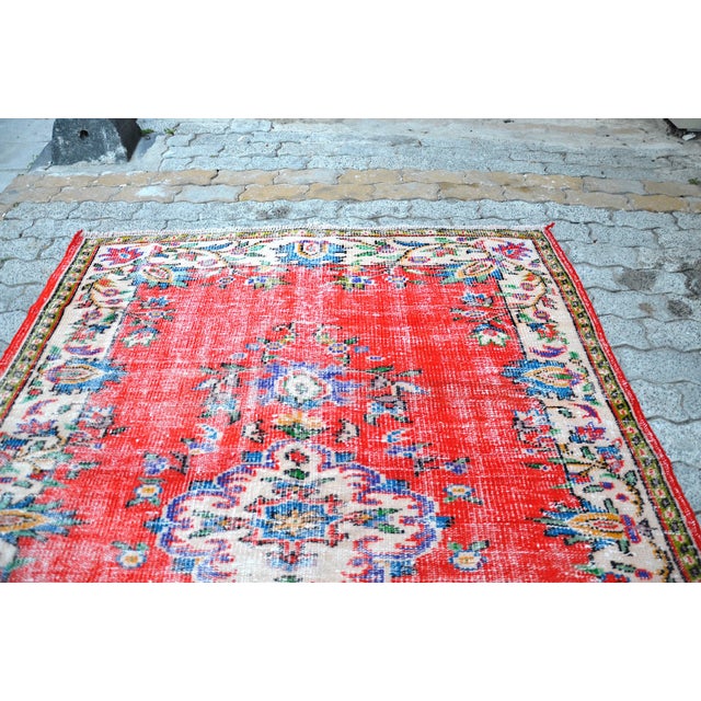 This is a vintage Turkish Anatolian kilim rug from the 1960s. The piece was hand-woven.