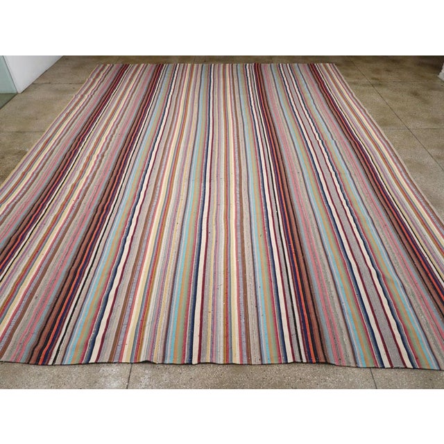 A vintage Turkish Flatweave Kilim large room size carpet handmade during the Mid-20 century. Measures: 13' 11" x 18' 2"