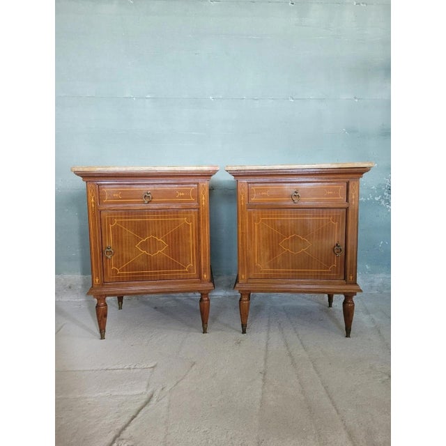 Pair of Louis XVI style veneered bedside tables with one door and one central drawer. Upper surface in marble. Excellent...