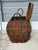 Large multi color woven basket. Bamboo reed strapping with interwoven rope and wood. Bent wood framing and knotted rope...