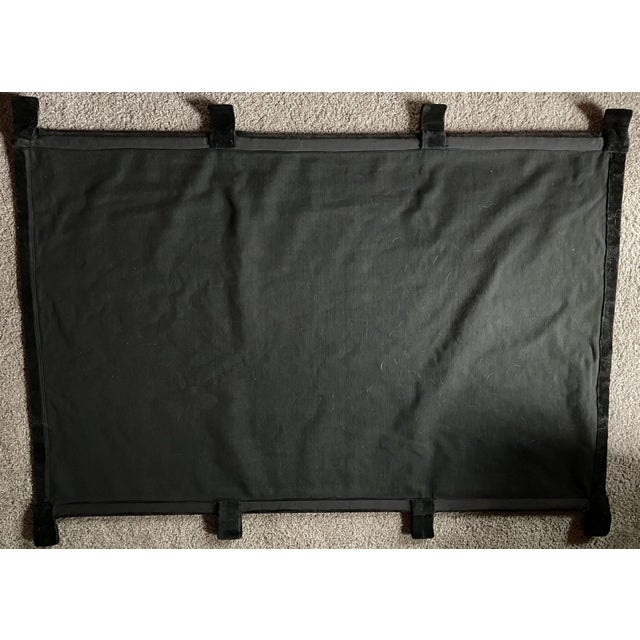 A vintage decorative wall hanging of painted velvet or velveteen. The piece depicts a romantic landscape with a...