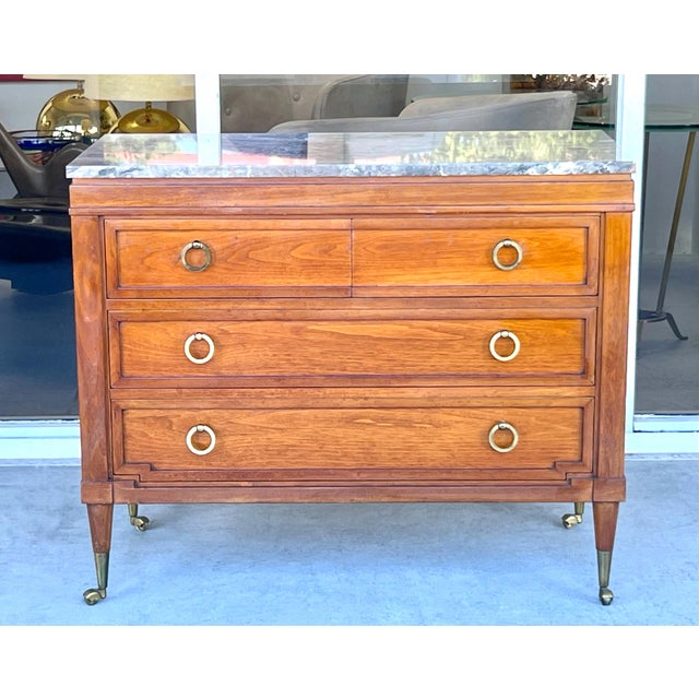 Wonderful chest of drawers, a modern take on a classic design. 4 drawers total. Note the bronze wheels and sabots along...