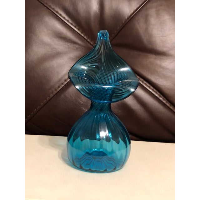 Add a striking pop of mid-century sculptured elegance to your space with this vintage hand-blown art glass vase. Crafted...