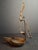 This rare 18th-century wrought iron double crusie (or "phoebe") grease lamp features elaborate folk art cut-out backplates...