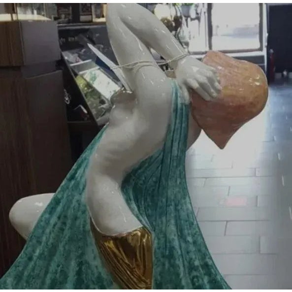 It is signed A. Godord on the side and is signed underneath france kaza edition.It is made of porcelain and is in near...