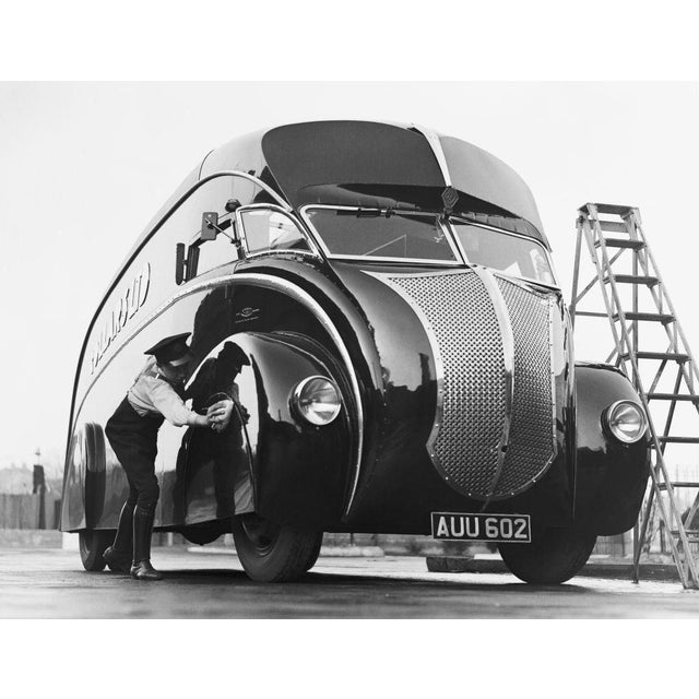 Pride And Joy A driver polishes his new streamlined lorry upon its arrival at Wembley, London. The lorry is mounted on a...