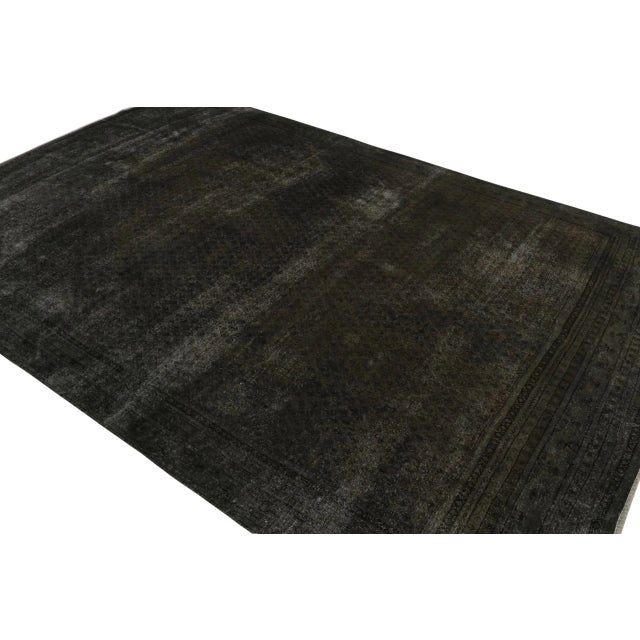 From our new collection of overdyed rugs, a vintage 9×12 Persian rug originating circa 1970-1980 or possibly earlier. On...