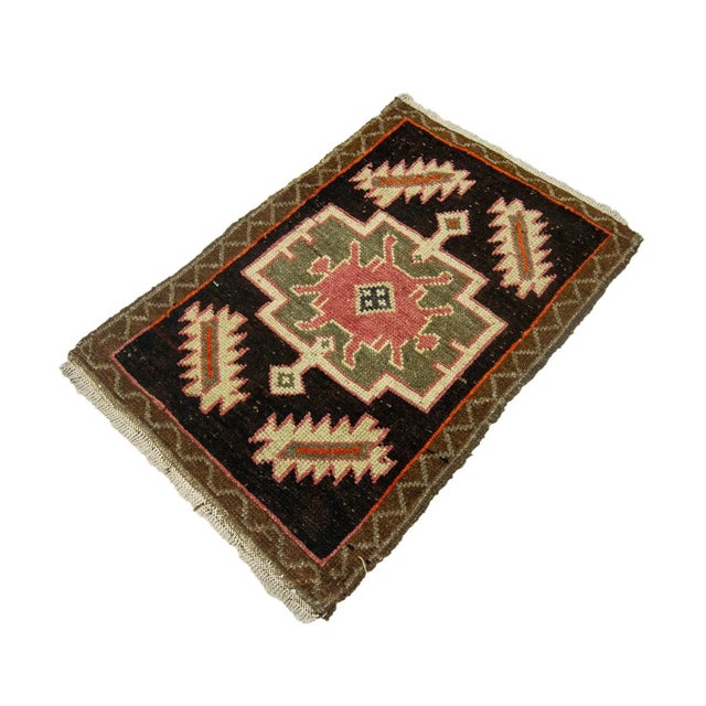 Vintage Handknotted decorative mini rug from Kars region of Turkey. Approximately 45-55 years old. In very good condition.