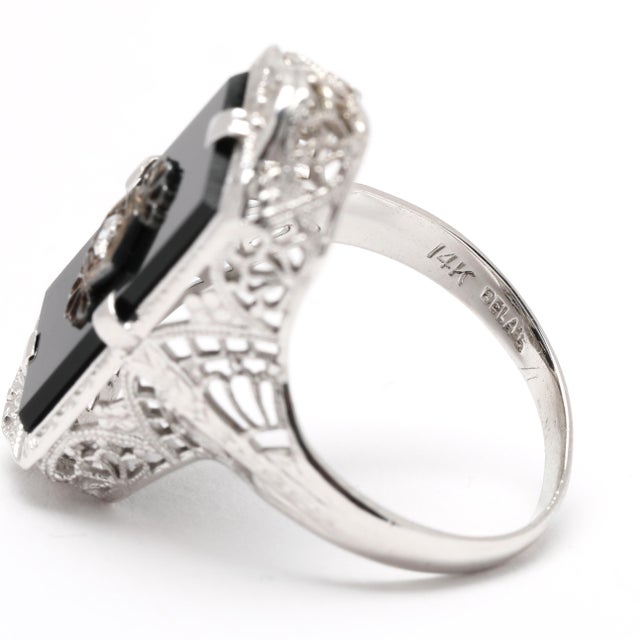 Stones: diamond, 1 trans 2 mm .03ctw GH color/ SI1 clarity black onyx, 1 rectangular tablet 16 x 8 mm Ring Size: 5 Rise...