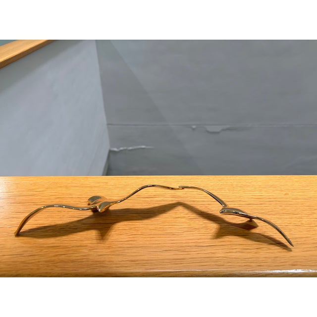 Striking vintage bronze sculpture depicting two stylized seagulls in flight, crafted in Europe circa 1970s–1980s. The...