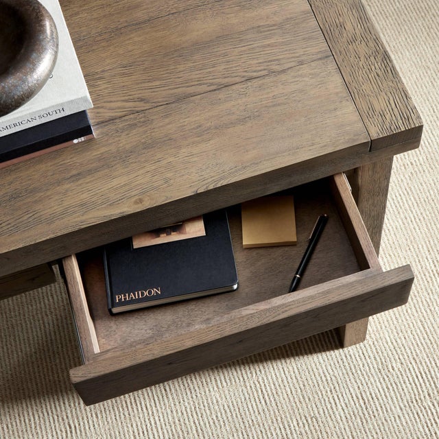 Worn oak shapes a streamlined desk with a naturally minimalist look. Four drawers for handy storage space.
