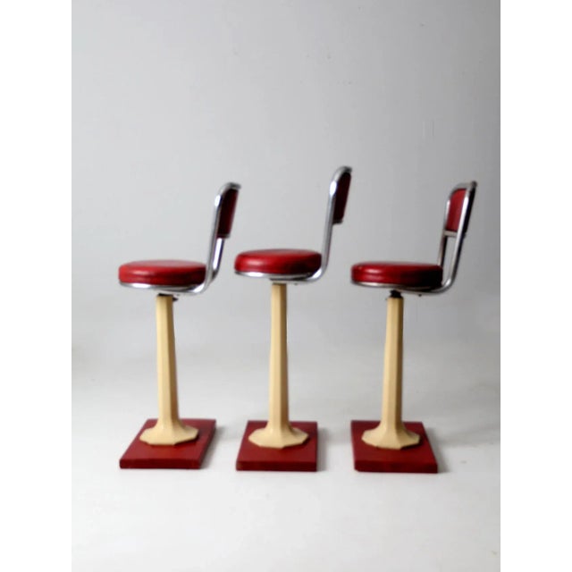 This collection of early 1900s soda fountain stools offers a wonderfully nostalgic take on vintage seating. Mounted on...