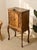 An extraordinary antique-style cabinet with elaborate carved and inlaid detailing inspired by French Louis XV and Belle...