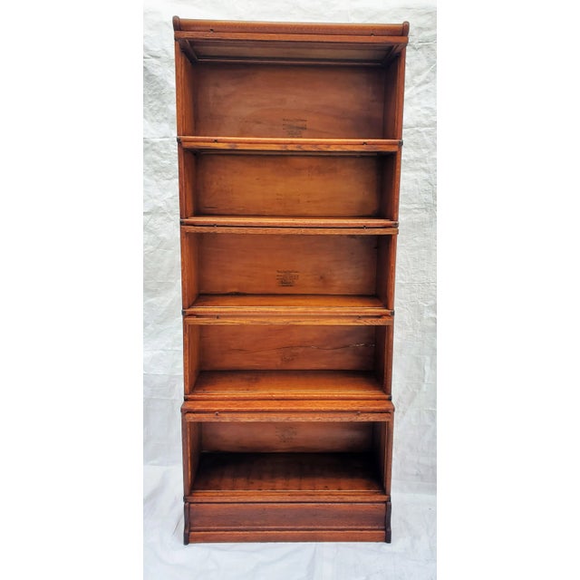 Very tall Wernicke Elastic 5 stack bookcase. Beautiful tiger (quarter sawn) oak. Unusual to find the stepped back style...
