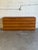 This minimalist lowboy chest of drawers features a sleek handleless front design and a plinth base. Clean geometric lines...