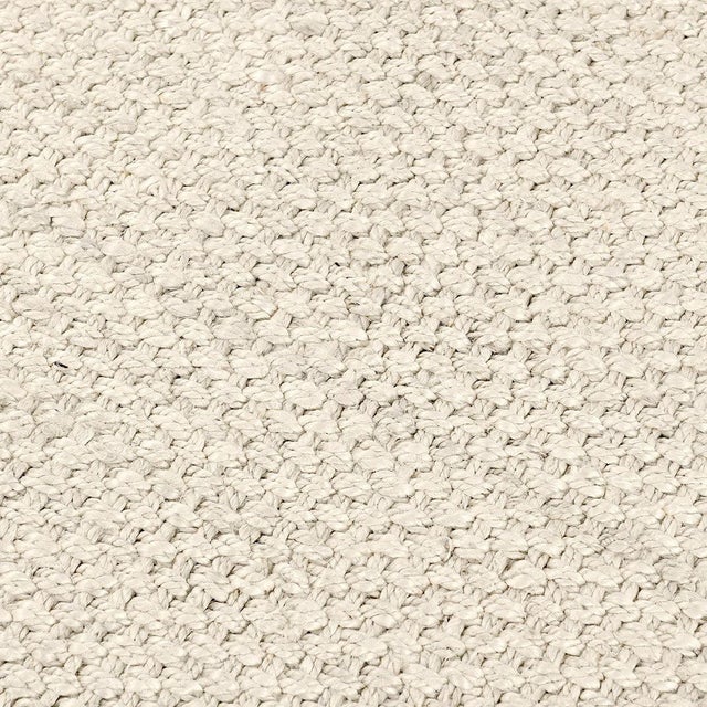 Hand spun and braided jute rug in an airy fresh ivory color. Available in numerous sizes. Please note that its appearance...