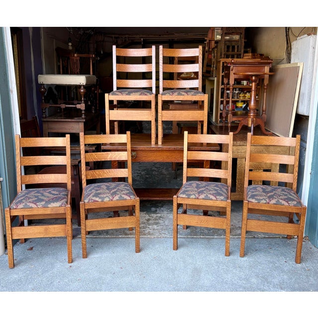 Sturdy Mission style dining chairs are constructed from quarter-sawn oak with a warm honey finish. Each chair has a 3 slat...