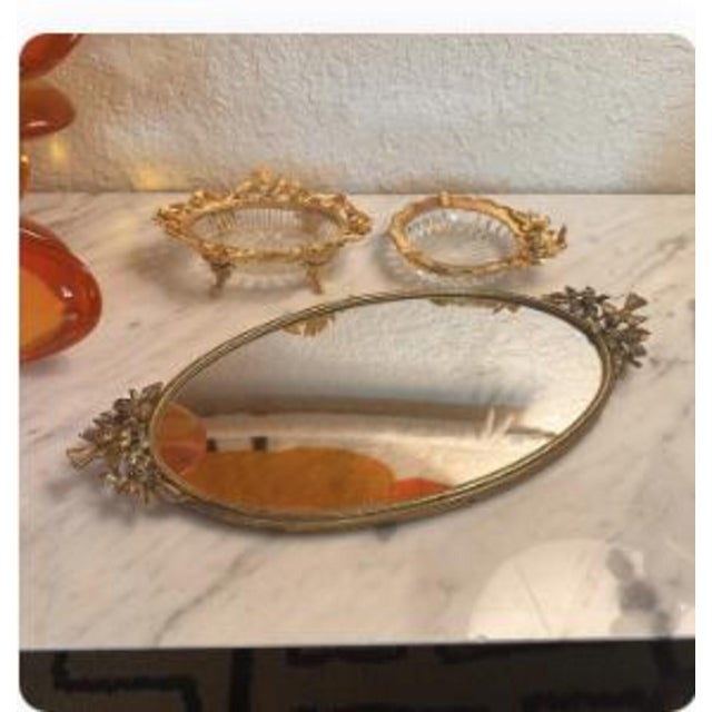 This Vintage Matson Footed Gold-Plated Gilt Ormolu vanity sets exudes Hollywood Regency glamour, with its ornate gold-...