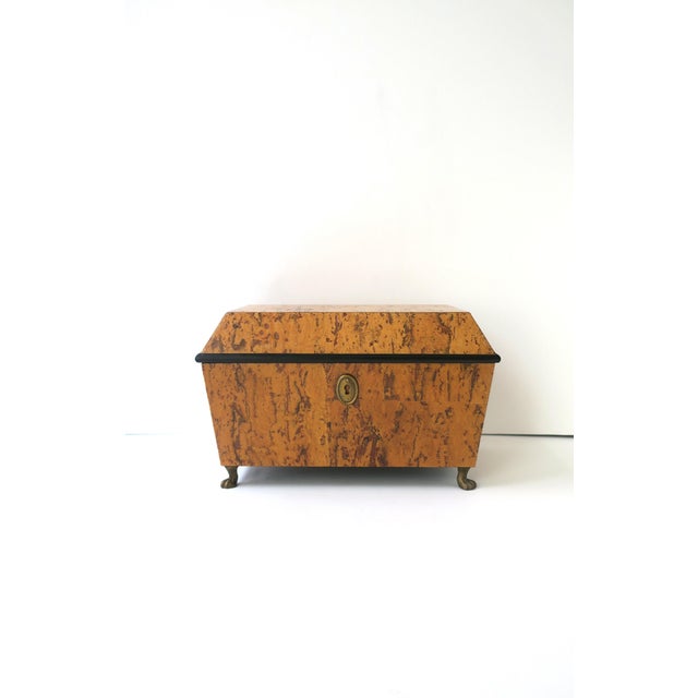 A tiger‑burl‑esque jewelry or decorative storage box in the Neoclassical Empire Revival style, circa late 20th century....